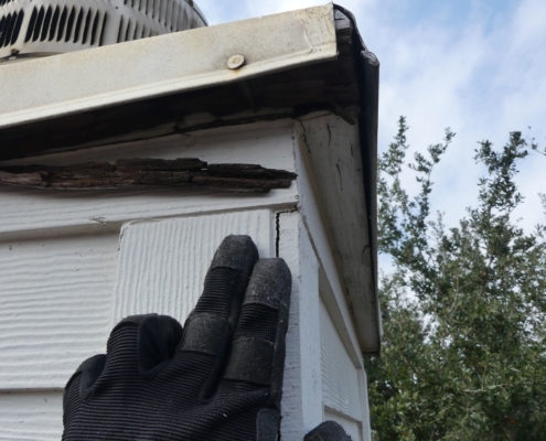 Deteriorated wood under chimney cap